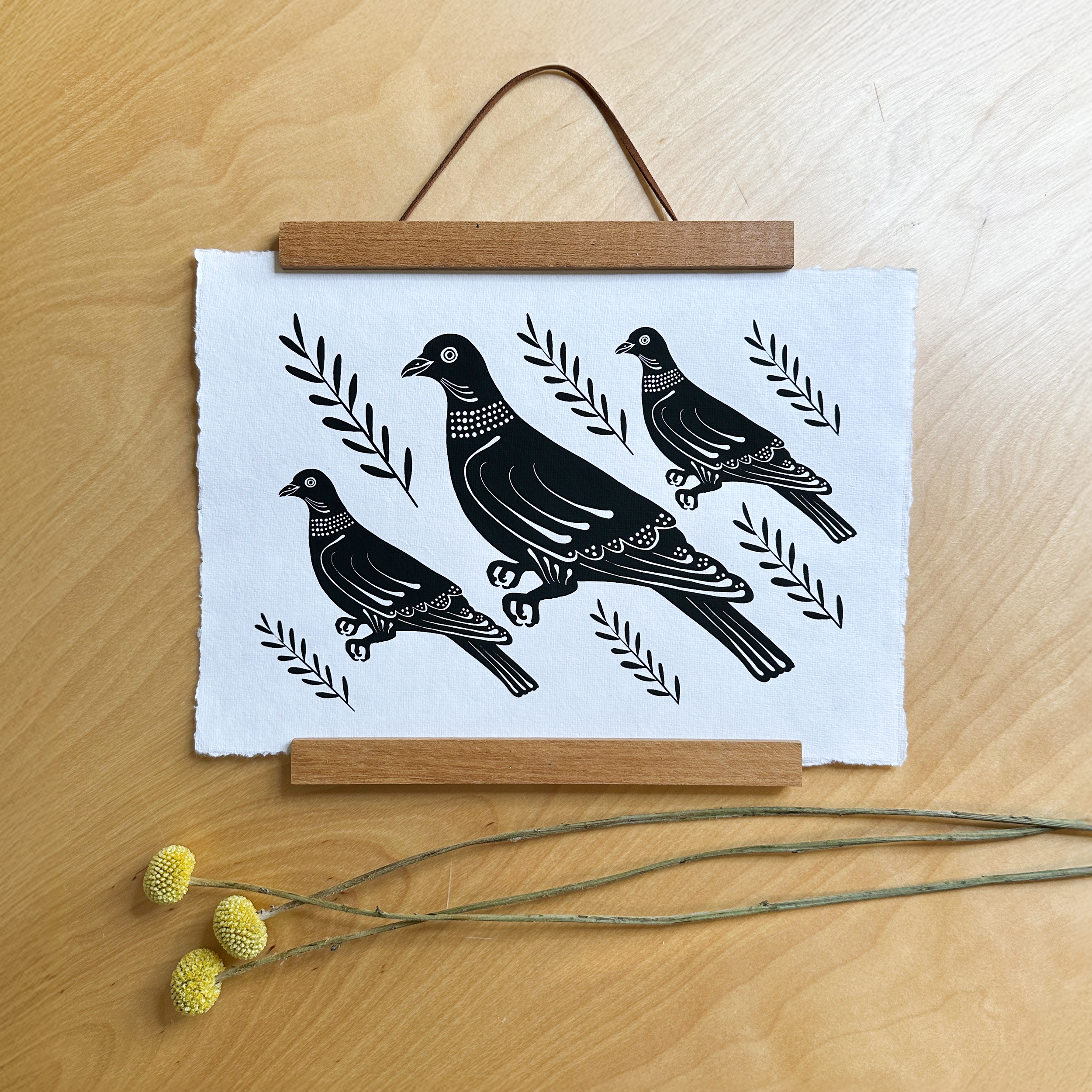 screen print showing 3 black pigeons on handmade paper